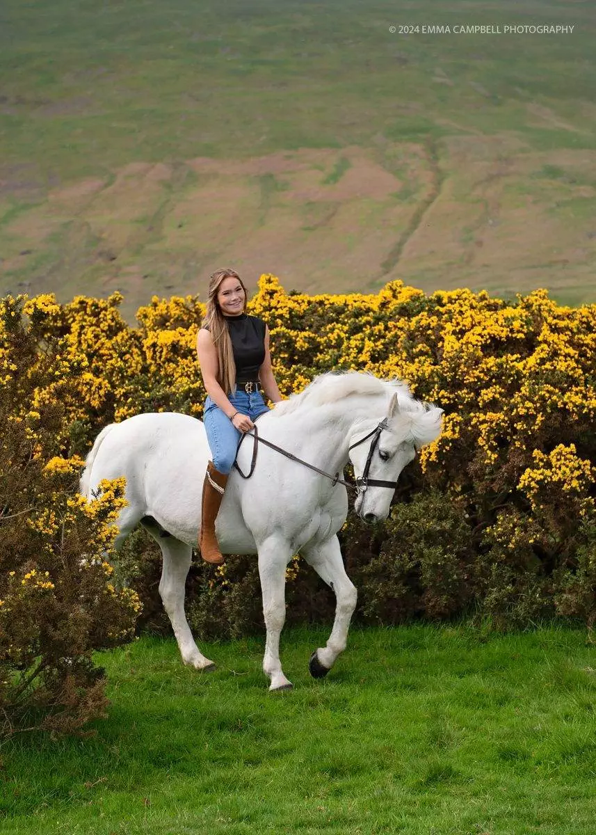Connie modeling on her horse Flip - for an equine portrait session with Digital Camera magazine - riding through gorse